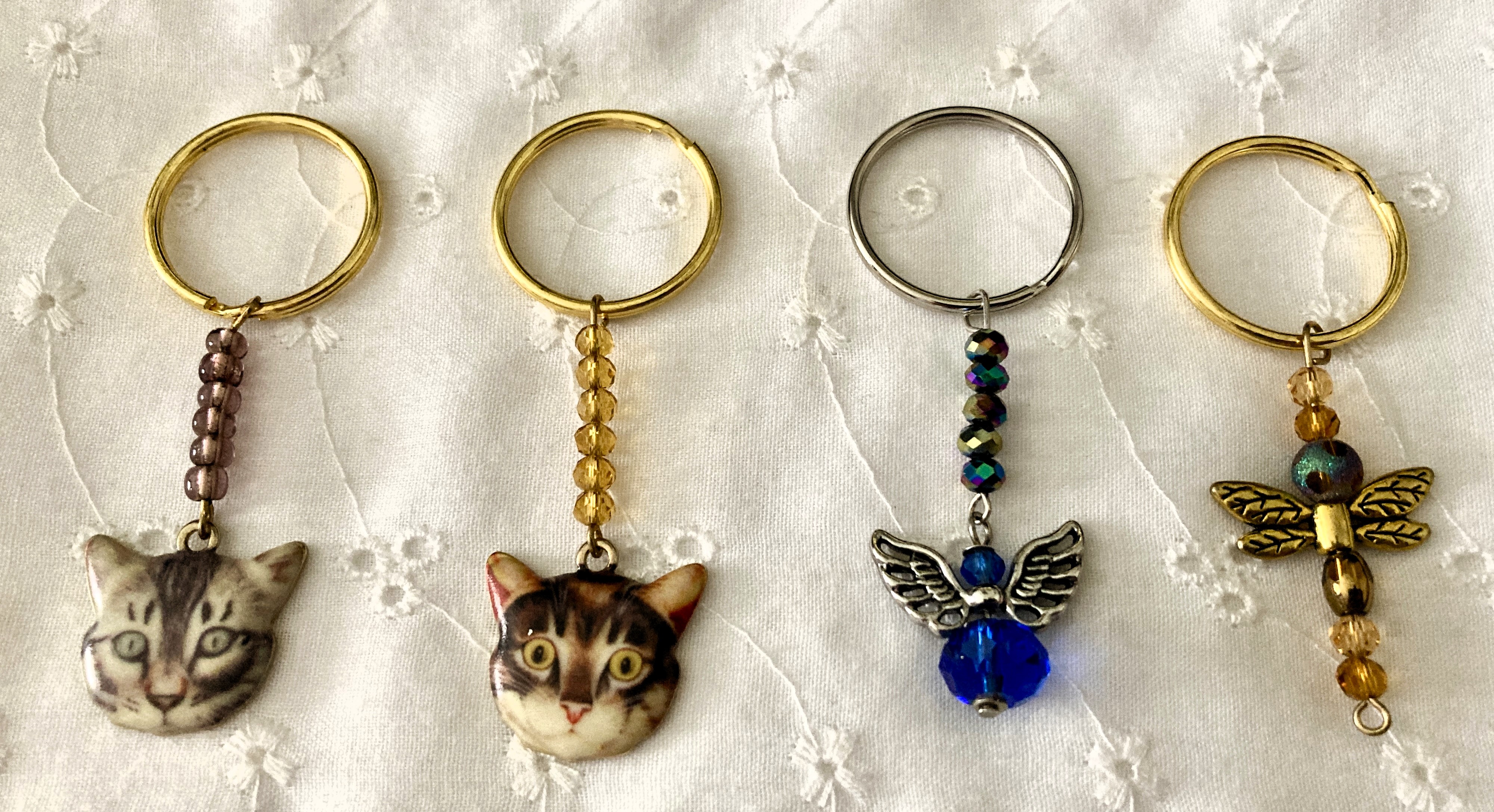 4 Key chains Cats, Angel, and Dragonfly..